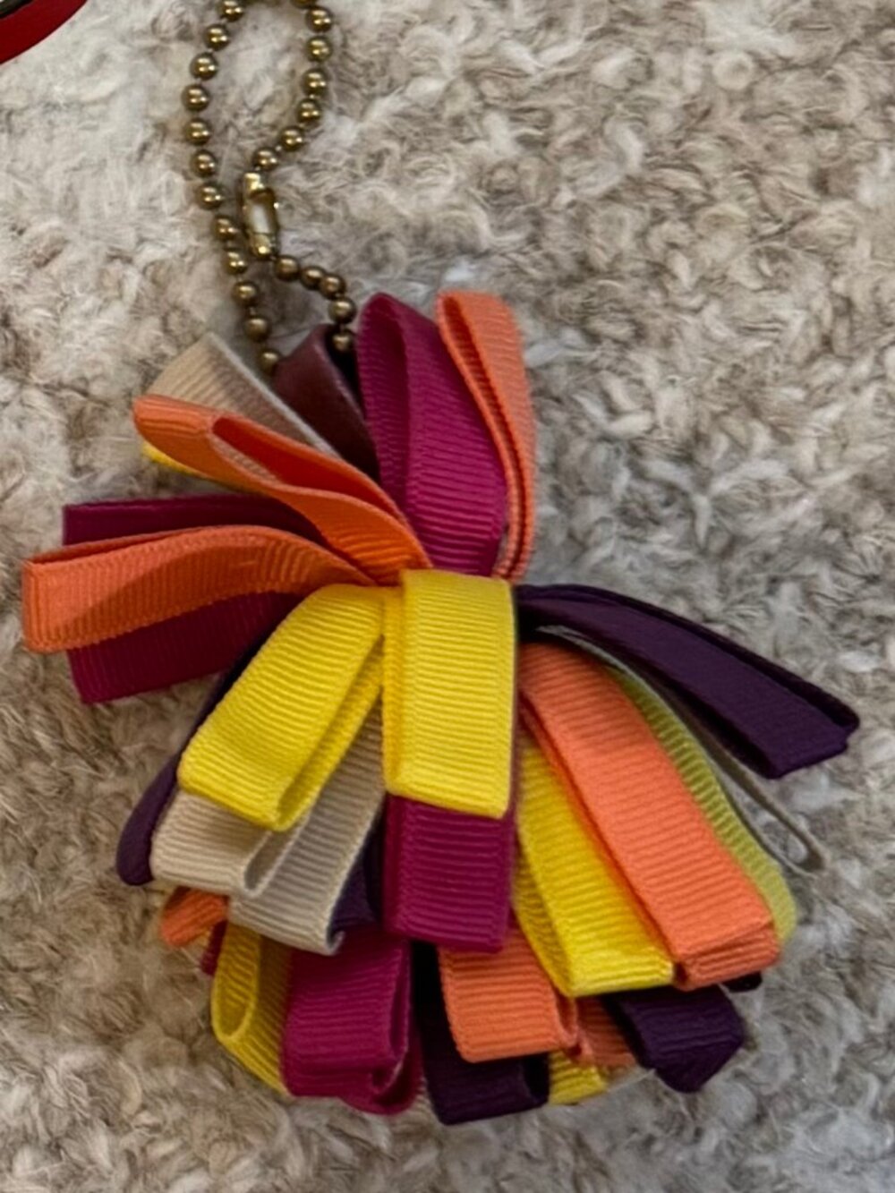 Coach Poppy Ribbon pompom